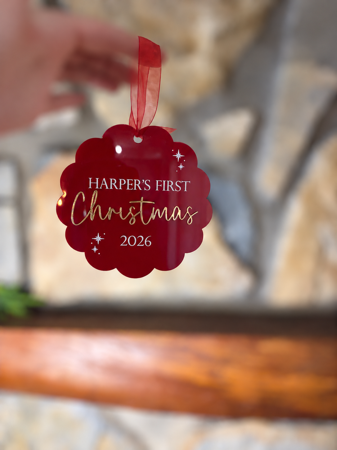 Personalised baby's first Christmas 2026 acrylic bauble featuring child's name, a keepsake Christmas tree ornament