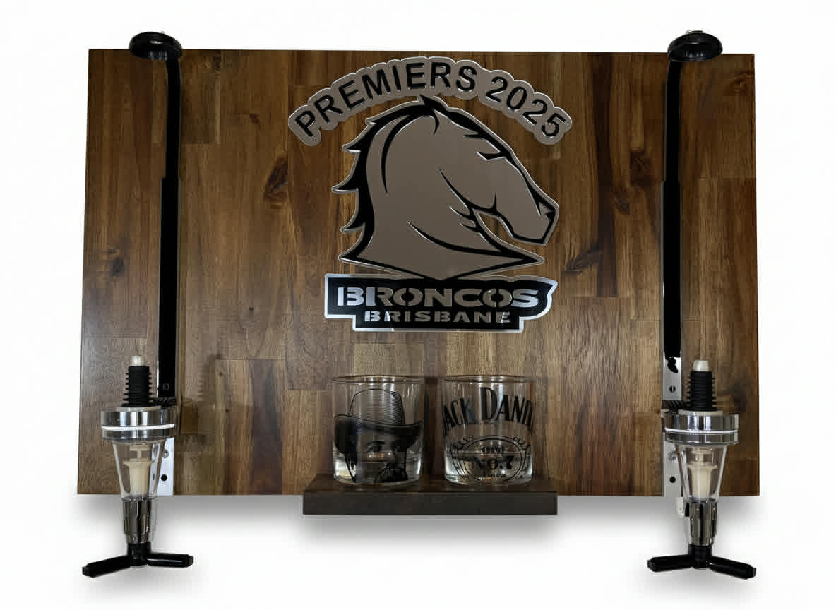 Wooden spirit pourer with Brisbane Broncos premiers 2025 logo, glasses, and bottles on a white background