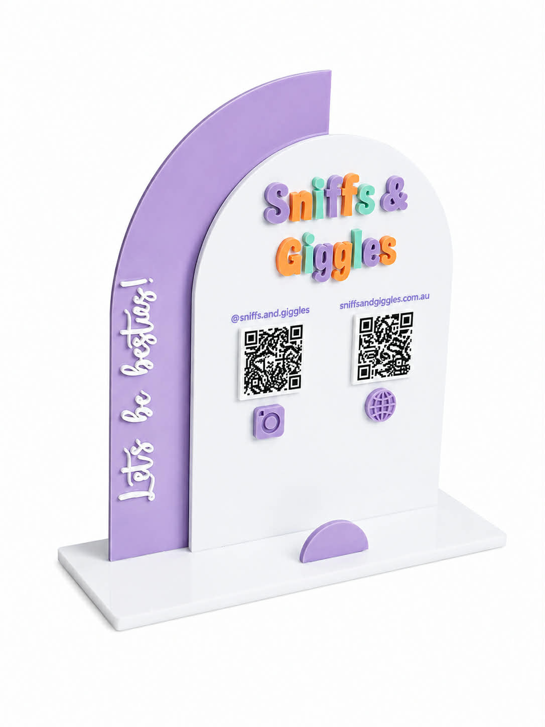 A white and lavender purple freestanding display stand with the text 'Sniffs & Giggles' in colorful letters, QR codes, social media handles, and 'Let's be besties!' written vertically on the side panel.