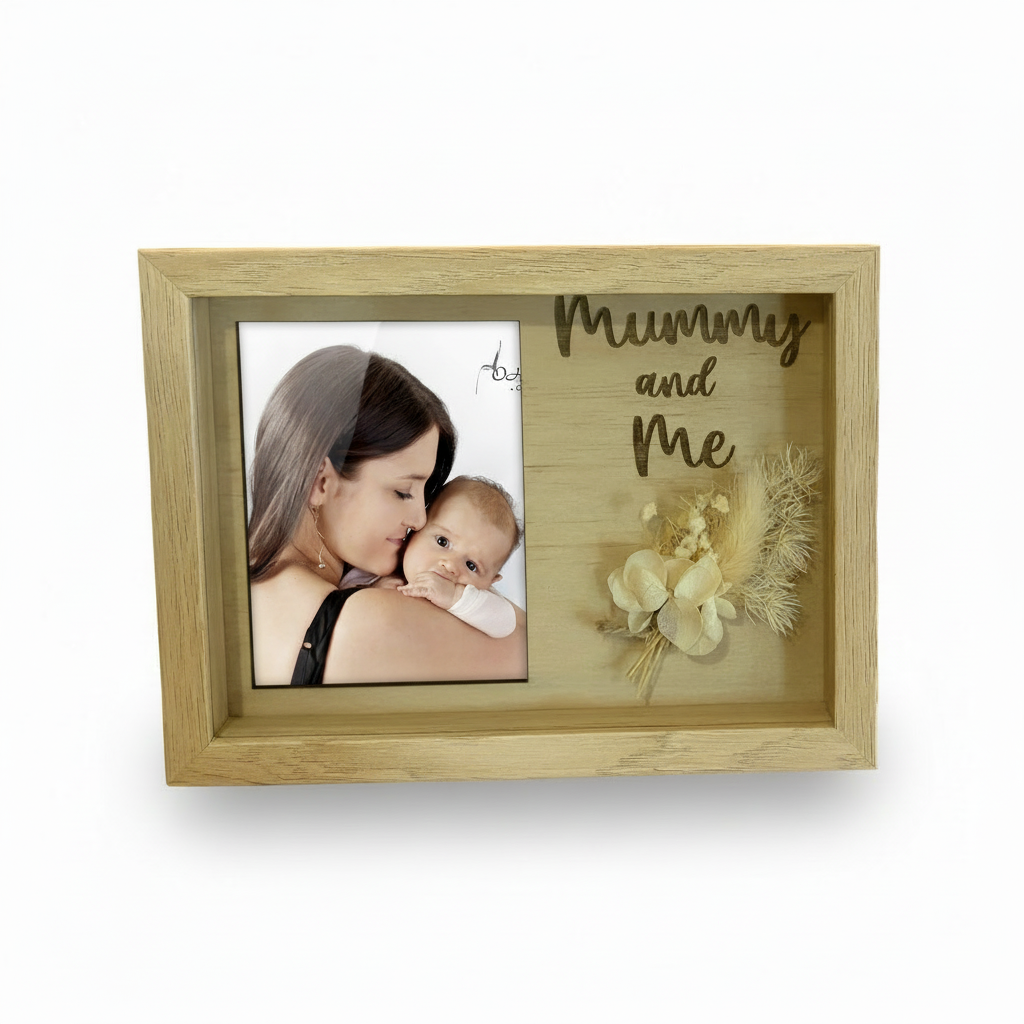 Wooden photo frame with 'Mummy and Me' text and a photo of a woman holding a baby.