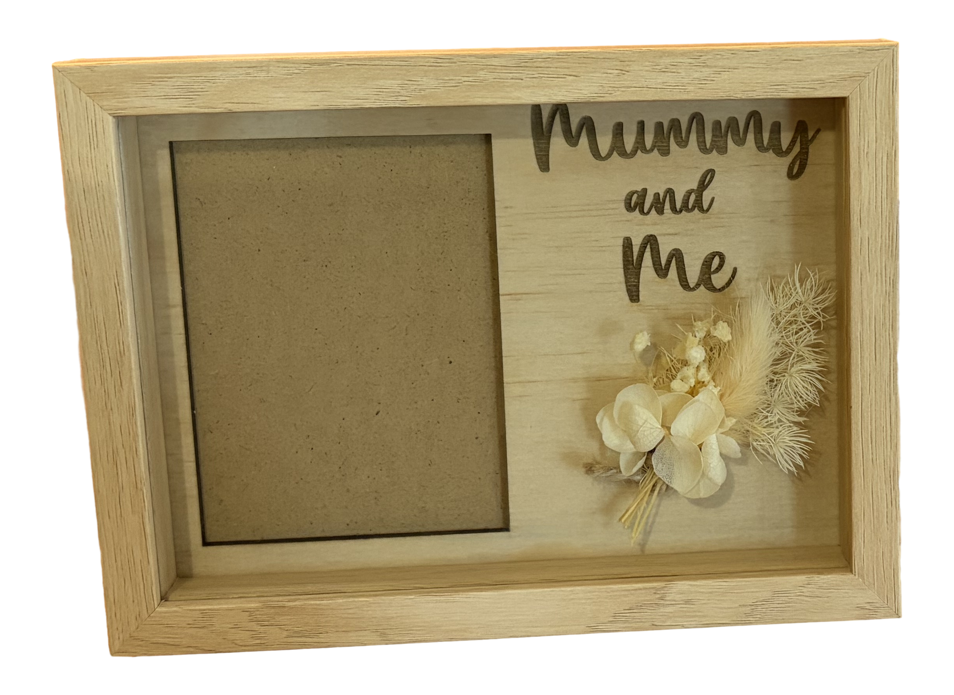 Wooden photo frame with 'Mummy and Me' engraving and floral decoration on a white background
