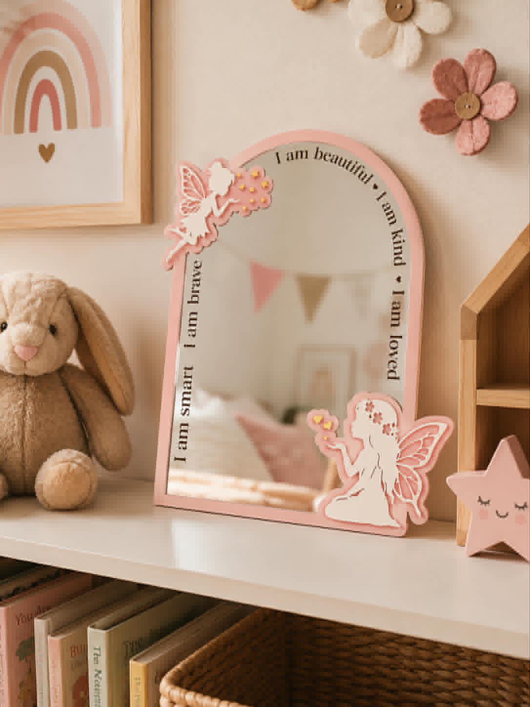 Personalised pink fairy affirmation acrylic mirror featuring engraved positive affirmations and layered fairy designs for a child's bedroom.