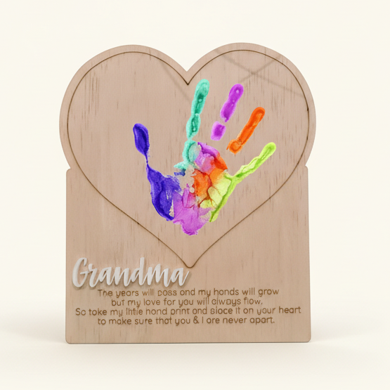 Handprint plaque keepsake styled on warm neutral wall
