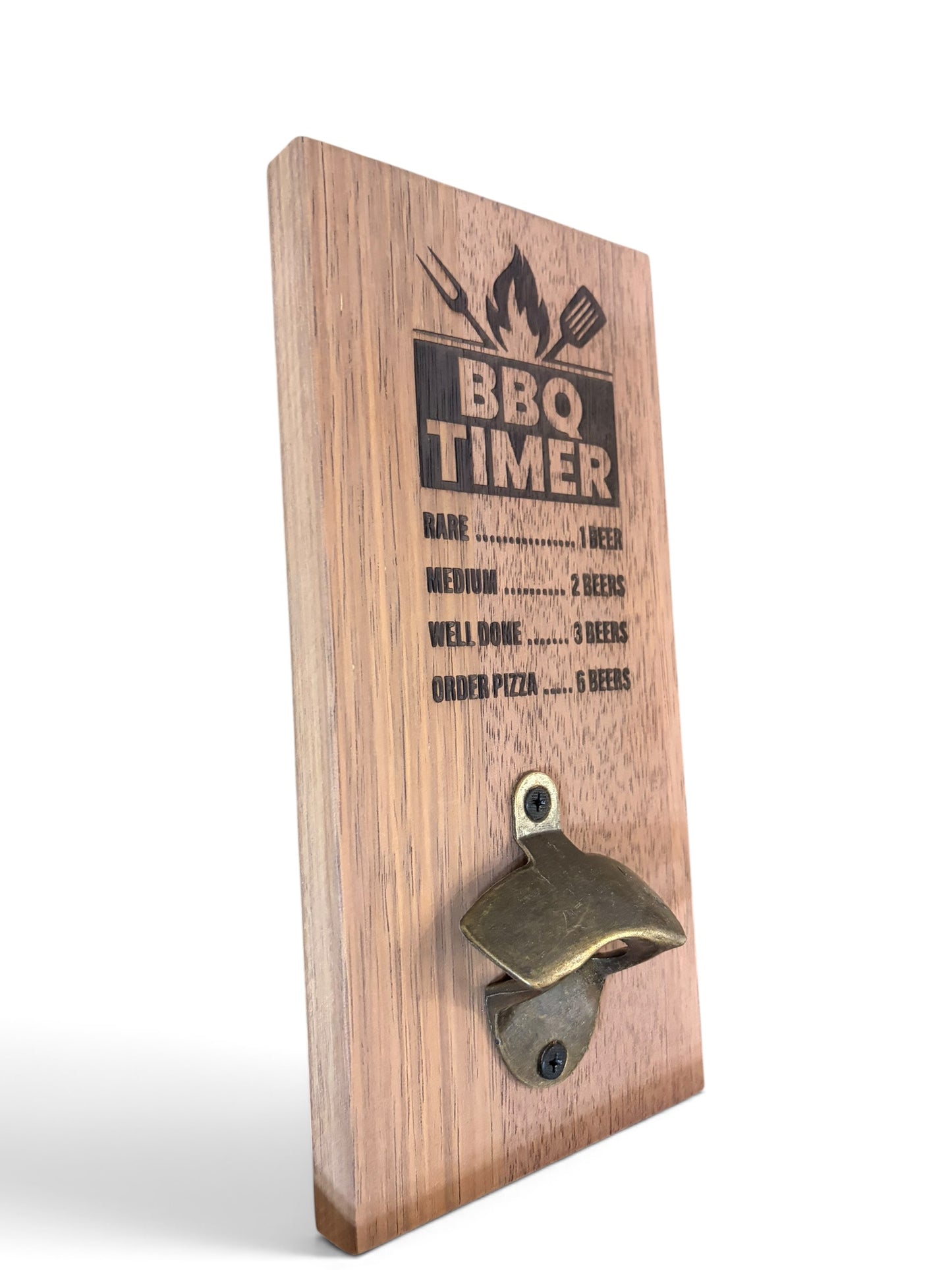 A wooden BBQ timer wall sign with a built-in bottle opener. The light brown wood panel features a black printed BBQ timer guide with flames and utensils, and a brass-colored bottle opener mounted near the bottom.