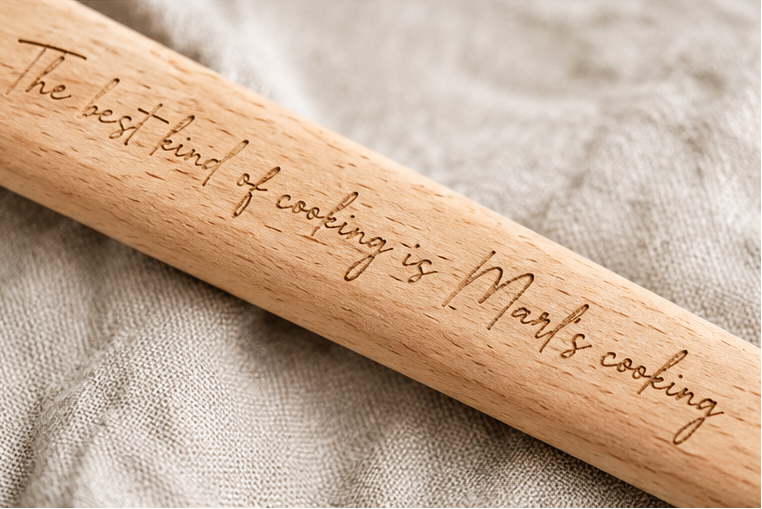 close up of custom engraving on a wooden spoon handle. 